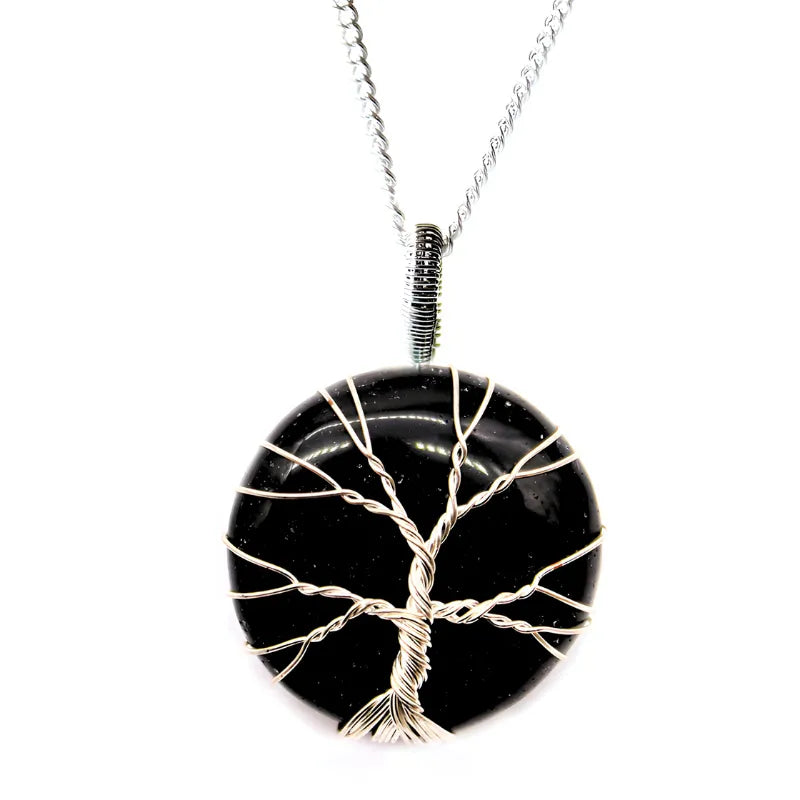 pendentif en pierre polie et fil torsadé motif arbre de vie et onyx